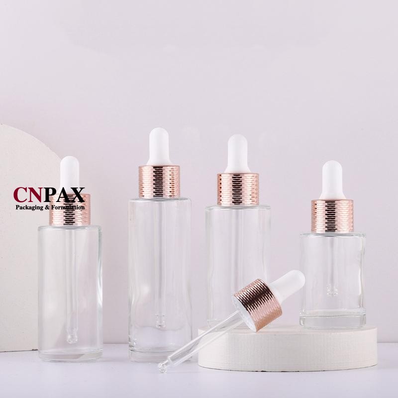 glass serum bottles with rose gold dropper dispenser