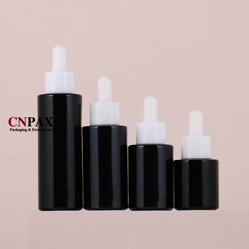 in stock black glass serum bottle with white dropper