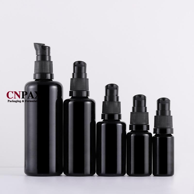 black glass bottle with black serum pump